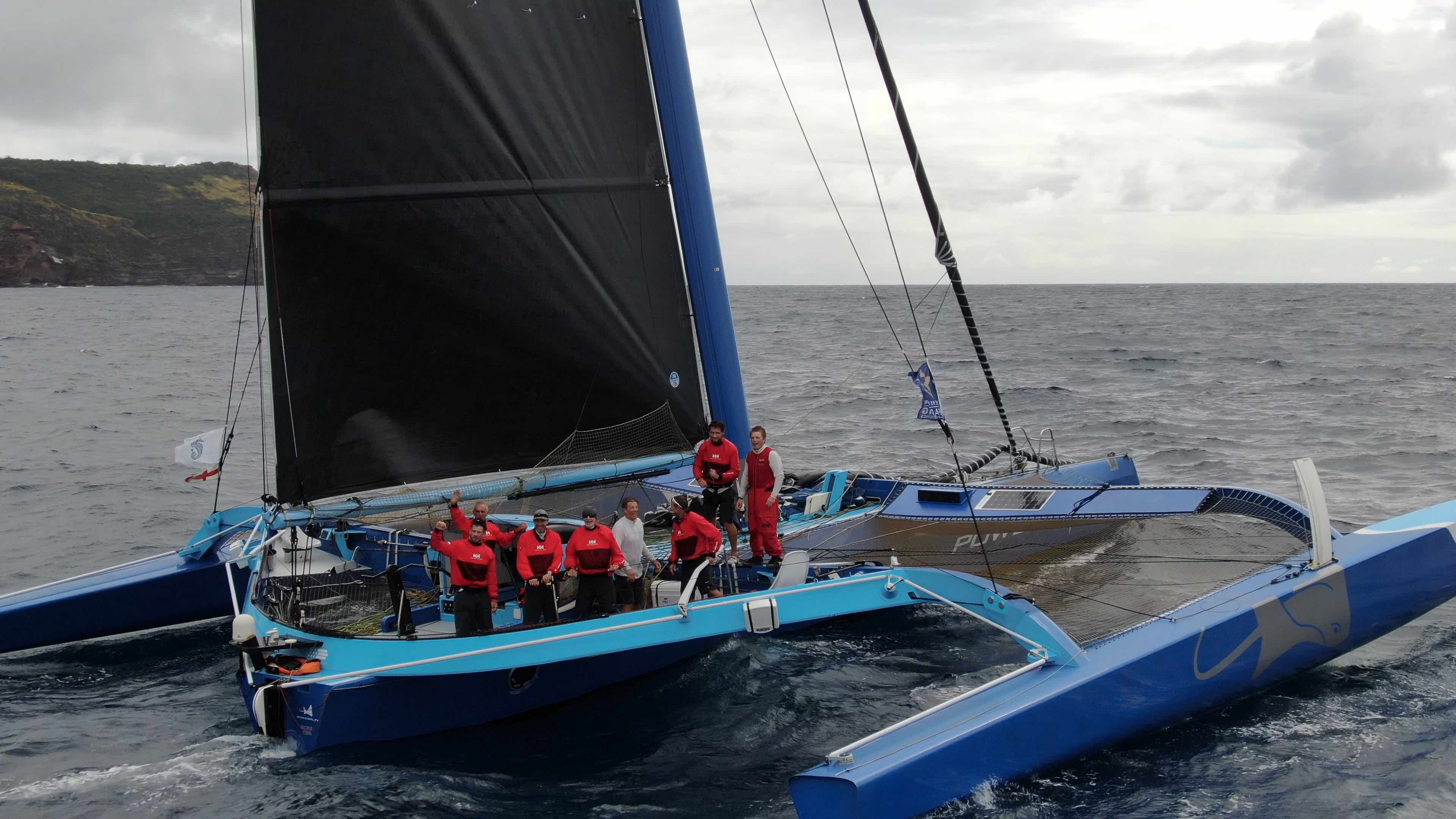 Peter Cunningham's MOD70 arrives in Antigua and the team celebrate their close victory in the MOCRA class after completing the course in 1 day 21 hrs 51 mins 34 secs © RORC