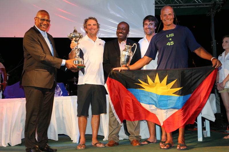 The crew of Bella Mente are presented with the RORC Caribbean Trophy for IRC Overall. Credit: RORC/Tim Wright/www.photoaction.com