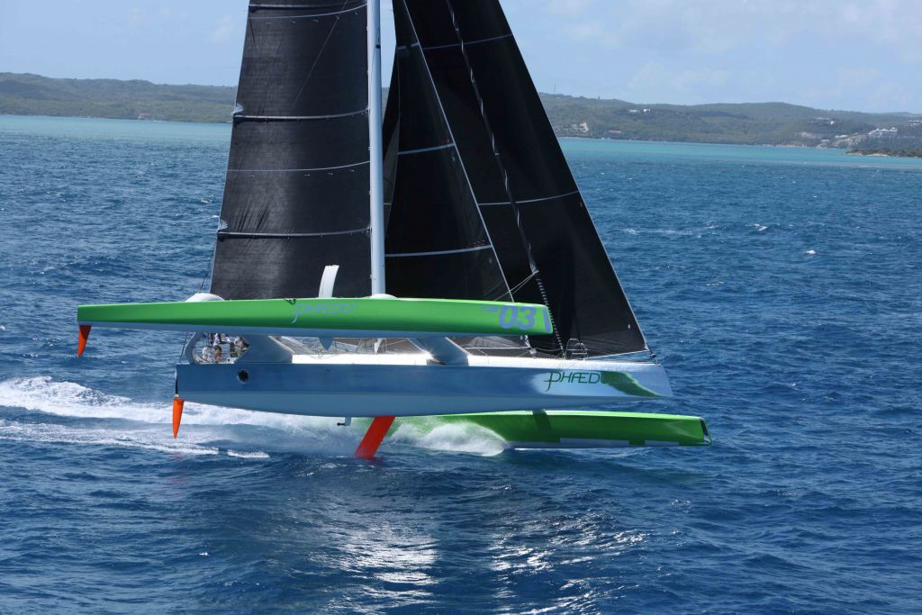 Phaedo3 flying two hulls past Willoughby Bay, Antigua - Credit: RORC/Tim Wright