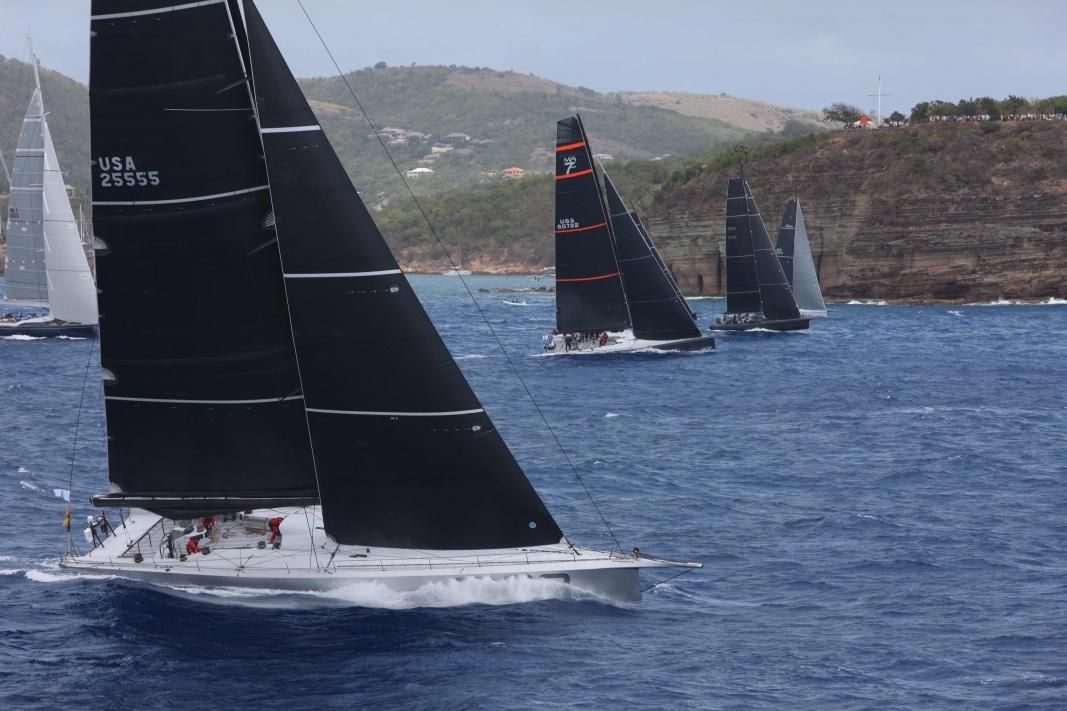 On record pace, George David's American Maxi Rambler 88 and the IRC Zero & Superyacht fleet at the start of the RORC Caribbean 600 off Fort Charlotte in Antigua today © RORC/Tim Wright/Photoaction.com