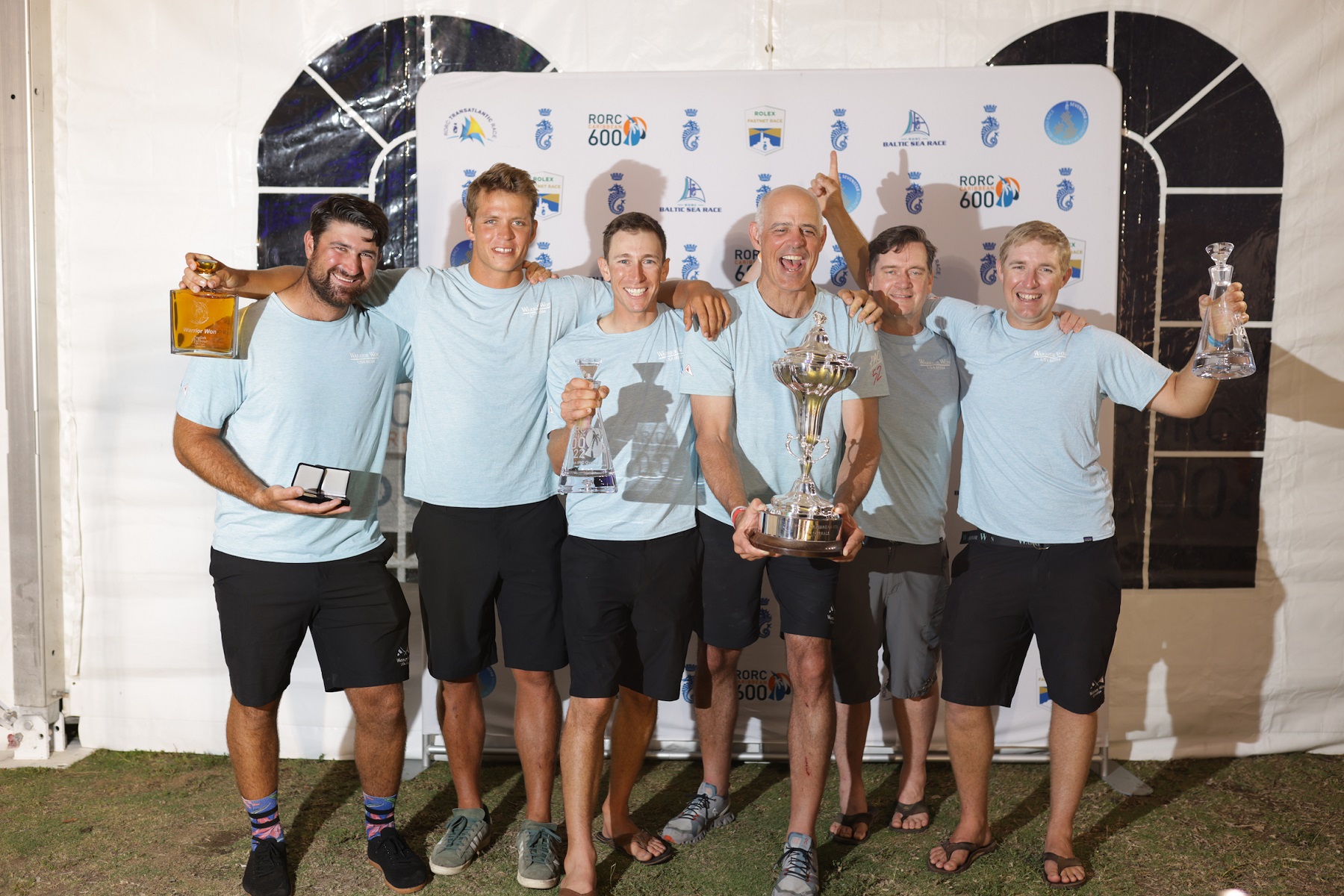 Christopher Sheehan and crew on the Pac52 Warrior Won lifted the RORC Caribbean 600 Trophy for best corrected time under IRC © Arthur Daniel/RORC