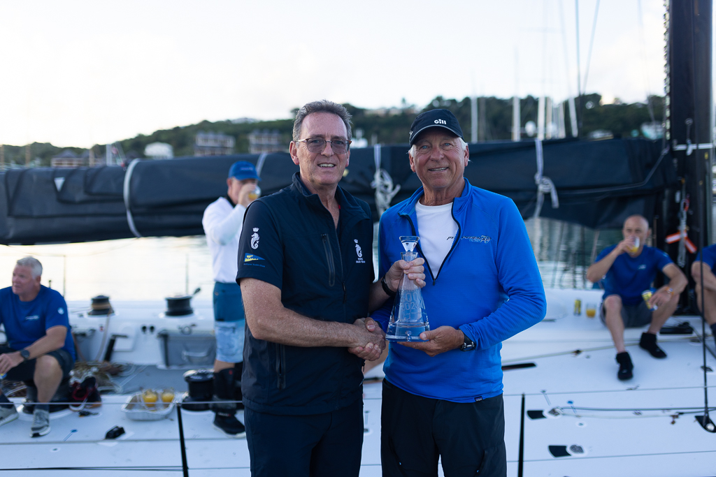 Pyewacket 70RORC CEO Jeremy Wilton presents skipper Ben Mitchell with the Monohull Line Honours trophy © Arthur Daniel/RORC